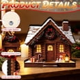 thumbnail image 4 of QuanTara Lighted Christmas House Decoration, Log Cabin with Wreath, Snowy Village Design, 4.72" × 4.33" × 0.79", Wooden LED Tabletop Accent for Shelf and Mantel, 4 of 8