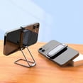 thumbnail image 1 of El soporte para teléfono móvil de escritorio con clip se puede girar 360 grados con imán para automóvil y se puede plegar para un fácil almacenamiento., 1 of 4