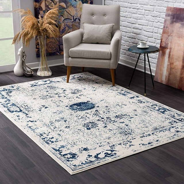homeroots home decor 390146 5’ x 8’ Navy Blue Distressed Floral Area Rug