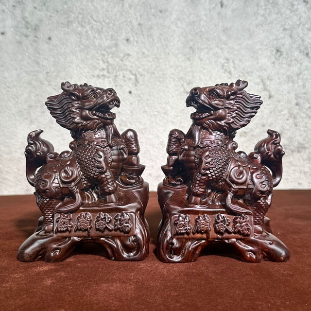 Large pair of ebony carved Qilin figurines, perfect for home decoration, attracting wealth and protecting the home. A feng shui gift made of redwood.