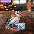 thumbnail image 5 of Rotating acrylic display showcasing a pelican skimming water with sandy shores and blue sea lavender in vibrant, detailed colors against a pure white background, 5 of 6