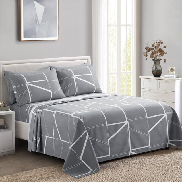 gray Marina Decoration sheet set with white fantasy geometric pattern on bed in bright room