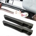thumbnail image 1 of ZHAOCHENG Tapón para ranuras de cuero para asientos de coche, universal, para SUV y camiones, para rellenar el espacio entre el asiento y la consola, color negro, paquete de 2, 1 of 5
