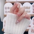 thumbnail image 2 of Nuevo diseño de uñas trapezoidales largas para niña con diseño de atrapasueños y armadura con acabado de mariposa y purpurina blanca, diseño de uñas extraíble, 2 of 5