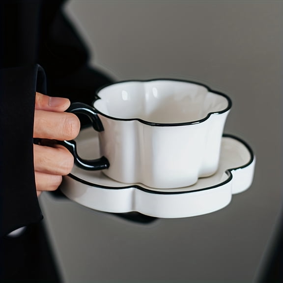 This Nordic minimalist petal-shaped ceramic coffee cup and saucer set is an elegant afternoon tea set for the office or home. High-quality, reusable, and hand-washable only, it's the perfect choice f