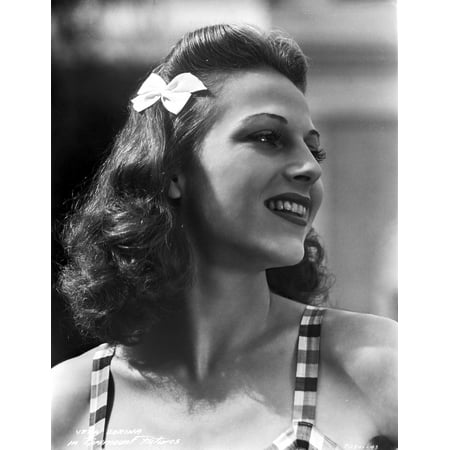 Vera Zorina looking away from the camera wearing stripped two-inch straps and a white bow in her hair Photo (Best Way To Strip Colour From Hair)