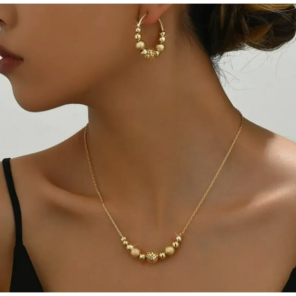Pierced gold chain and frosted bead necklace and hoop earring set