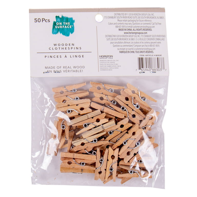 Premium Photo  Wooden clothes pins on the wooden surface