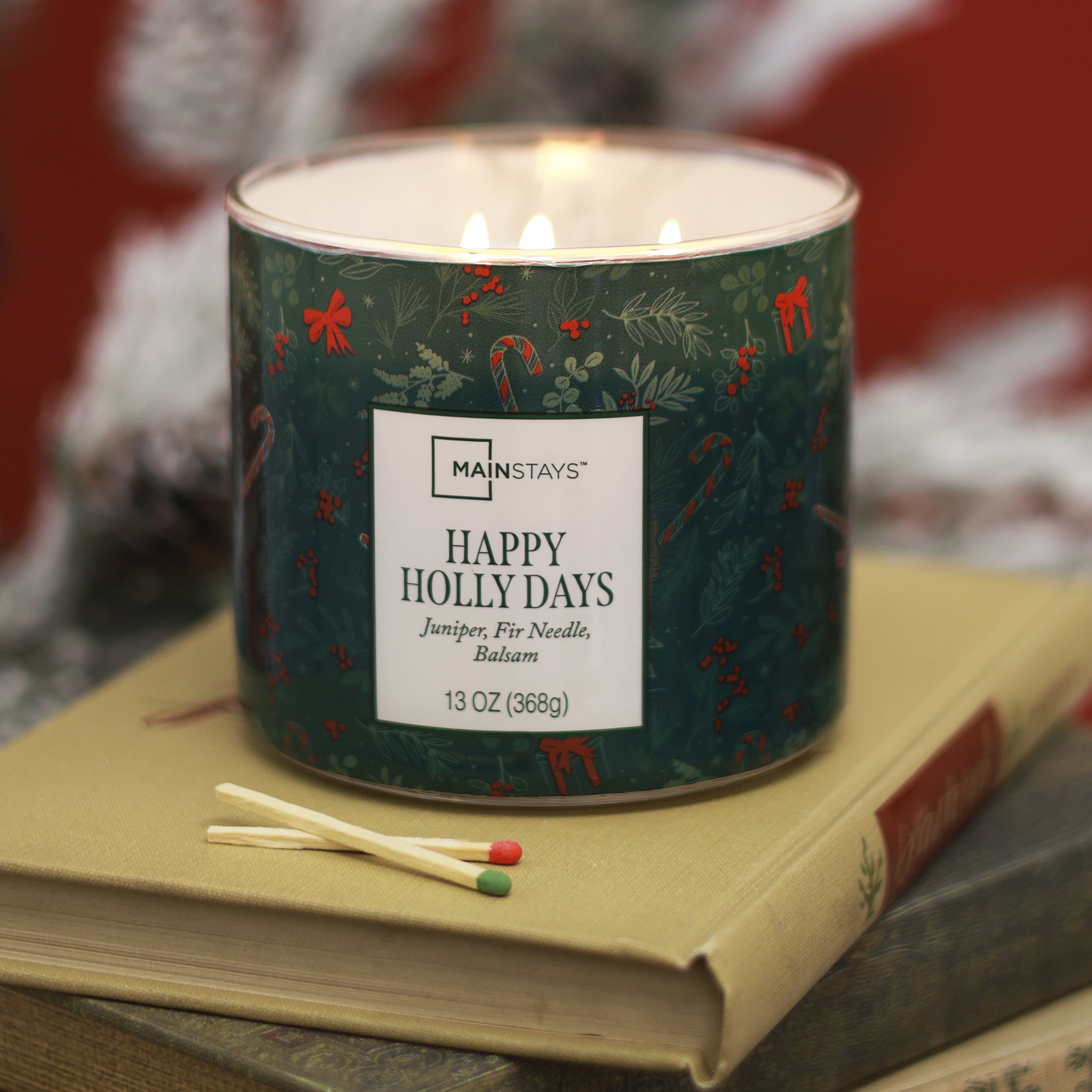 Mainstays 3-Wick Happy Holly Days Scented Candle with a Green Garland Toss Scene Wrap, 13-Ounce