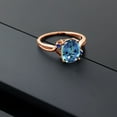 thumbnail image 4 of Gem Stone King 18K Rose Gold Plated Silver Millennium Blue Mystic Topaz and Blue Created Sapphire 3 Stone Ring for Women (3.04 Cttw, Oval 10X8MM, Gemstone Birthstone, Size 9), 4 of 4