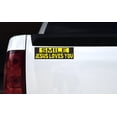 thumbnail image 2 of 10in x 3in Yellow and Black Smile Jesus Loves You Bumper Sticker, 2 of 3