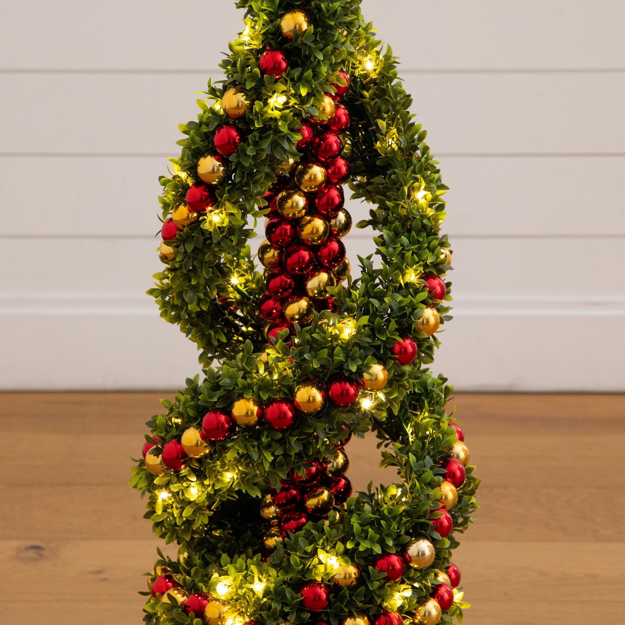 3ft. Pre-Lit Artificial Christmas Spiral Boxwood Topiary Tree with Ornaments and 70 LED Lights in Decorative Urn