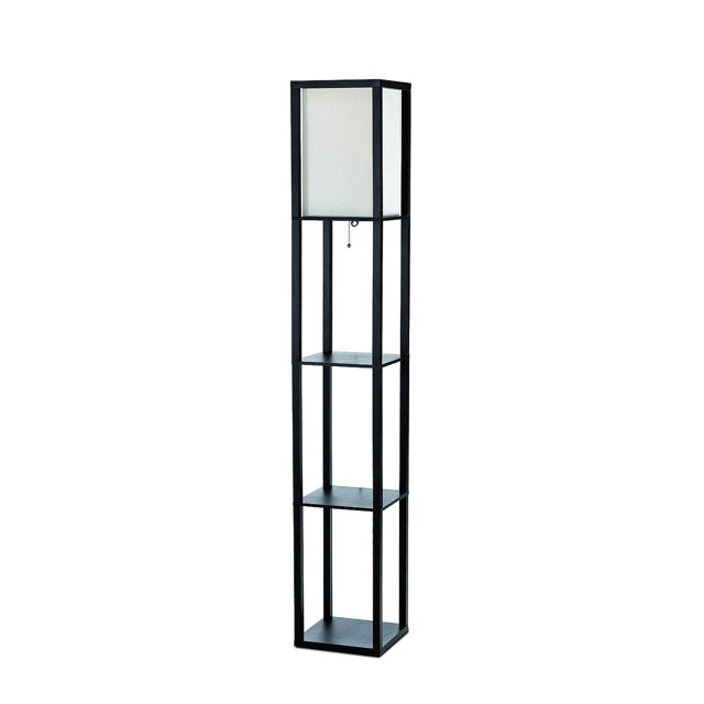 Simple Designs Floor Lamp Etagere Organizer Storage Shelf with Linen Shade, a tall black metal floor lamp with three open square shelves for storage or display, topped with a white linen shade that casts a soft warm glow, featuring a pull-chain on/off switch and measuring 10.2 by 10.2 by 62.75 inches, often used to display photos or small décor while providing ambient lighting.