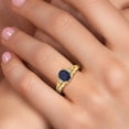 thumbnail image 4 of Gem Stone King 18K Yellow Gold Plated Silver Blue Sapphire and White Lab Grown Diamond 3 Stone Engagement Ring for Women | 1.88 Cttw | Oval 8X6MM | Round 2MM | Gemstone September Birthstone | Size 9, 4 of 6