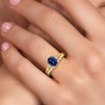 thumbnail image 4 of 18K Yellow Gold Plated Silver Blue Created Sapphire and White Lab Grown Diamond 3 Stone Engagement Ring for Women | 1.68 Cttw | Oval 8X6MM | Round 2MM | Gemstone September Birthstone | Size 9, 4 of 6