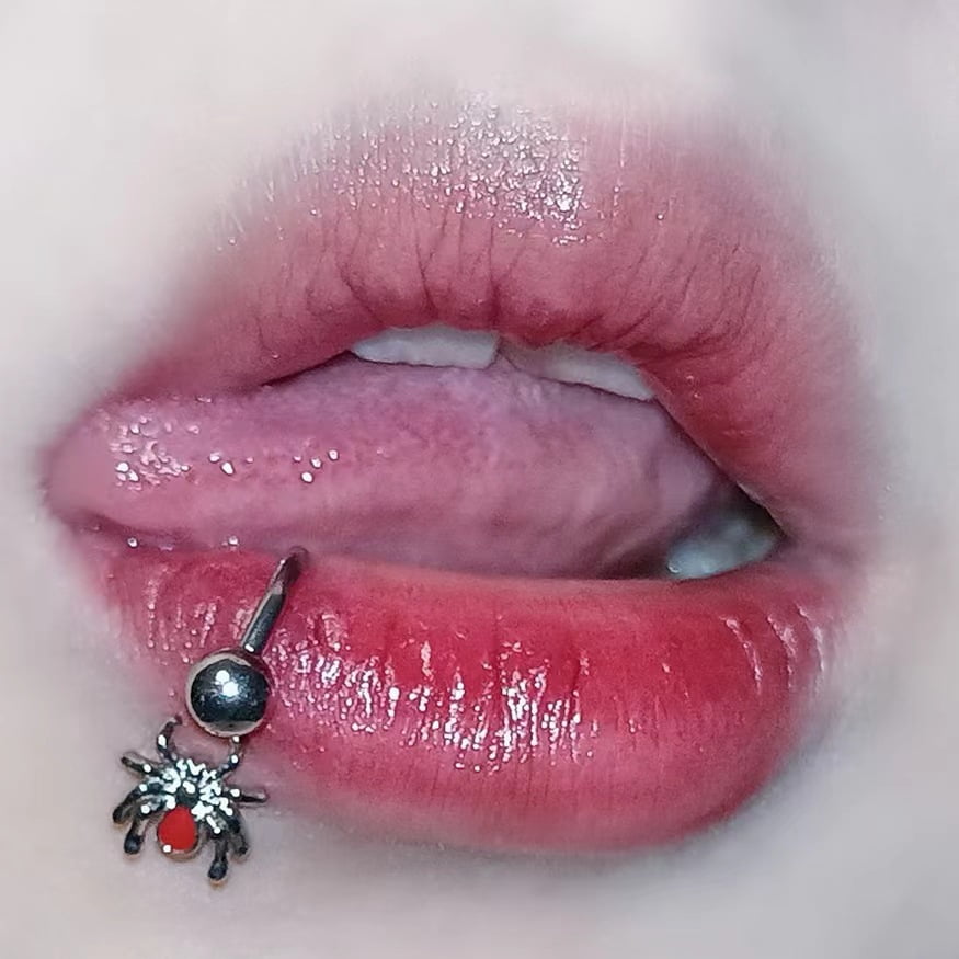 Black ring lip piercing outlet