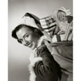 thumbnail image 2 of Portrait of a young woman carrying a sack of Christmas presents on her back Poster Print (24 x 36), 2 of 4