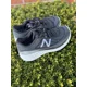 thumbnail image 1 of New Balance Black and White Running Shoes, 1 of 6