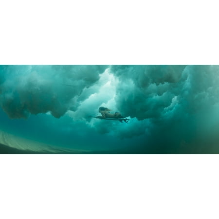 Female surfer pushes under a wave while surfing Clansthal South Africa Stretched Canvas - Panoramic Images (27 x