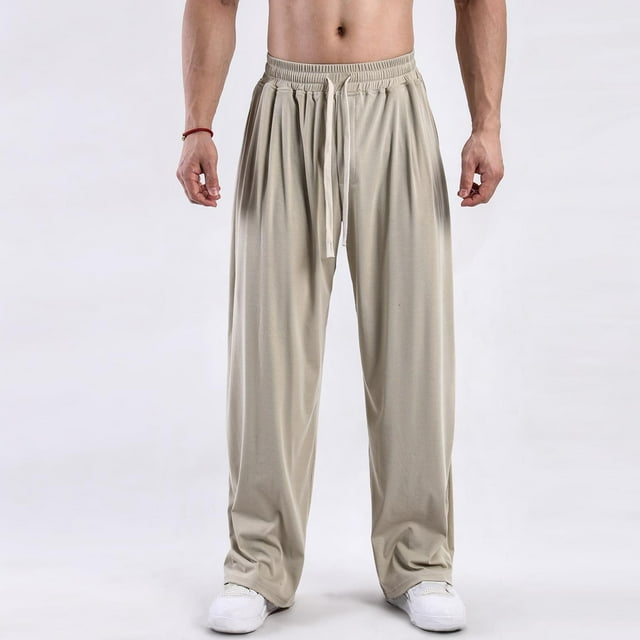 Pantalones largos de moda para hombre, casuales, de color sólido, con cintura elástica y bolsillos, con pernera ancha, de poliéster.
