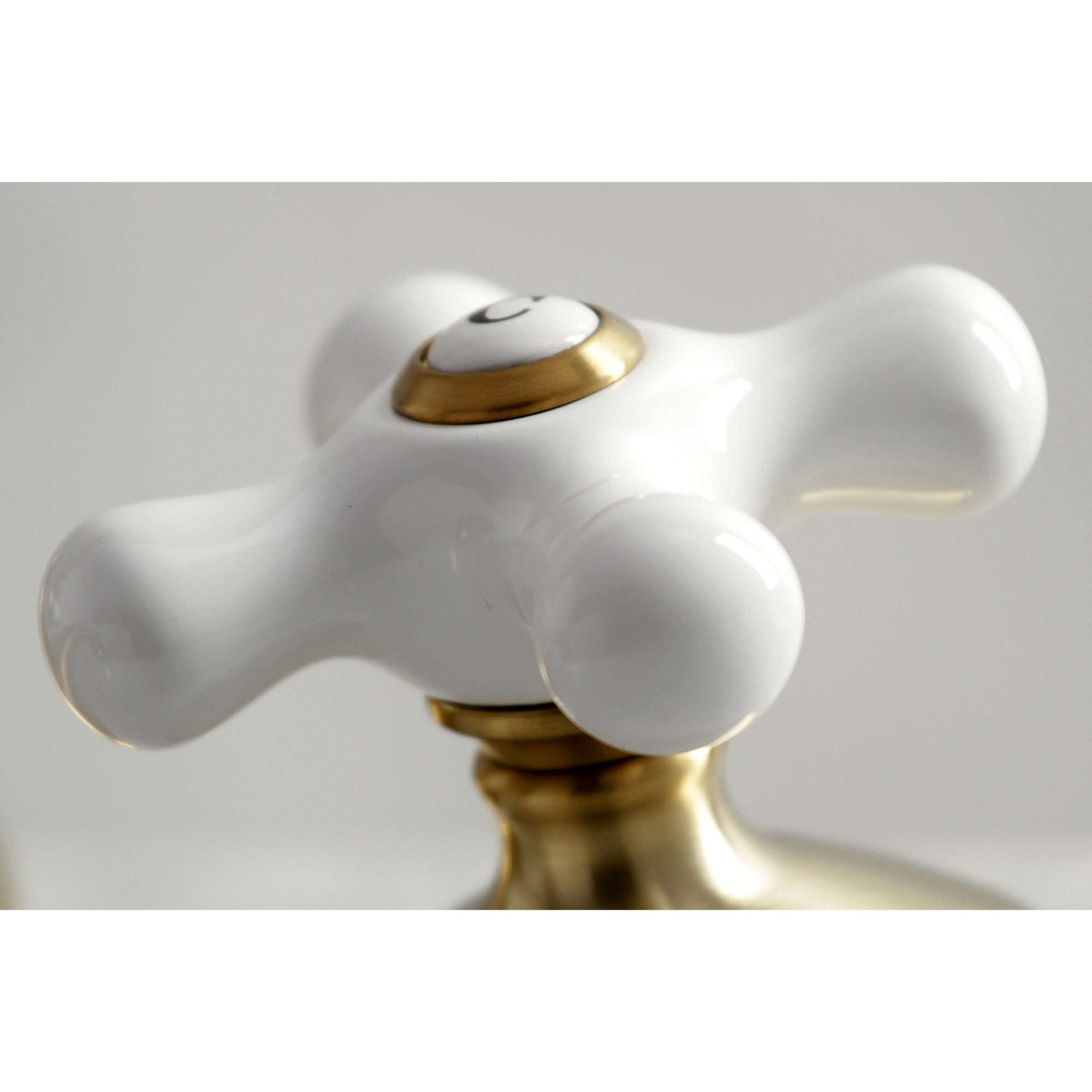 Kingston Brass KS1167PX Heritage Two-Handle 3-Hole Deck Mount Widespread Bathroom Faucet with Brass Pop-Up in Brushed Brass