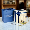 thumbnail image 5 of STP GOODS Graceful Bloom Enamel Glass Mug with Spoon in Gift Box 11.8 fl oz (350 ml) Floral Cup with Teaspoon Coffee and Tea Mug, Blue Clear, 5 of 6