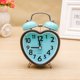 thumbnail image 3 of 1 reloj despertador creativo de metal con forma de corazón, con timbre de escritorio, moderno, con luz nocturna, para casa, estudiantes, dormitorio, sin batería (color aleatorio)., 3 of 5