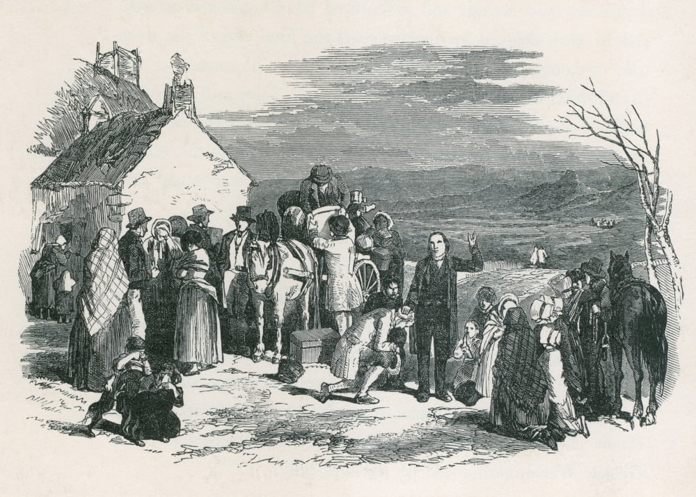 A Catholic Priest Blesses Kneeling Immigrants As They To Leave Their