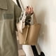 thumbnail image 2 of Nueva versión coreana 2025 de un bolso de cubo portátil de nicho, bolso bandolera popular de moda para mujer, bolso de hombro versátil para desplazamientos diarios., 2 of 5