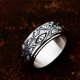 thumbnail image 1 of Anillo giratorio de acero inoxidable Anillo de acero de titanio con diseño retro de ojo de diablo europeo y americano para hombre, 1 of 5