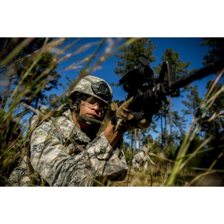 November 1 2012 - Airman aims an M-4 assault rifle during improvised explosive device lane training at Moody Air Force Base Georgia Poster