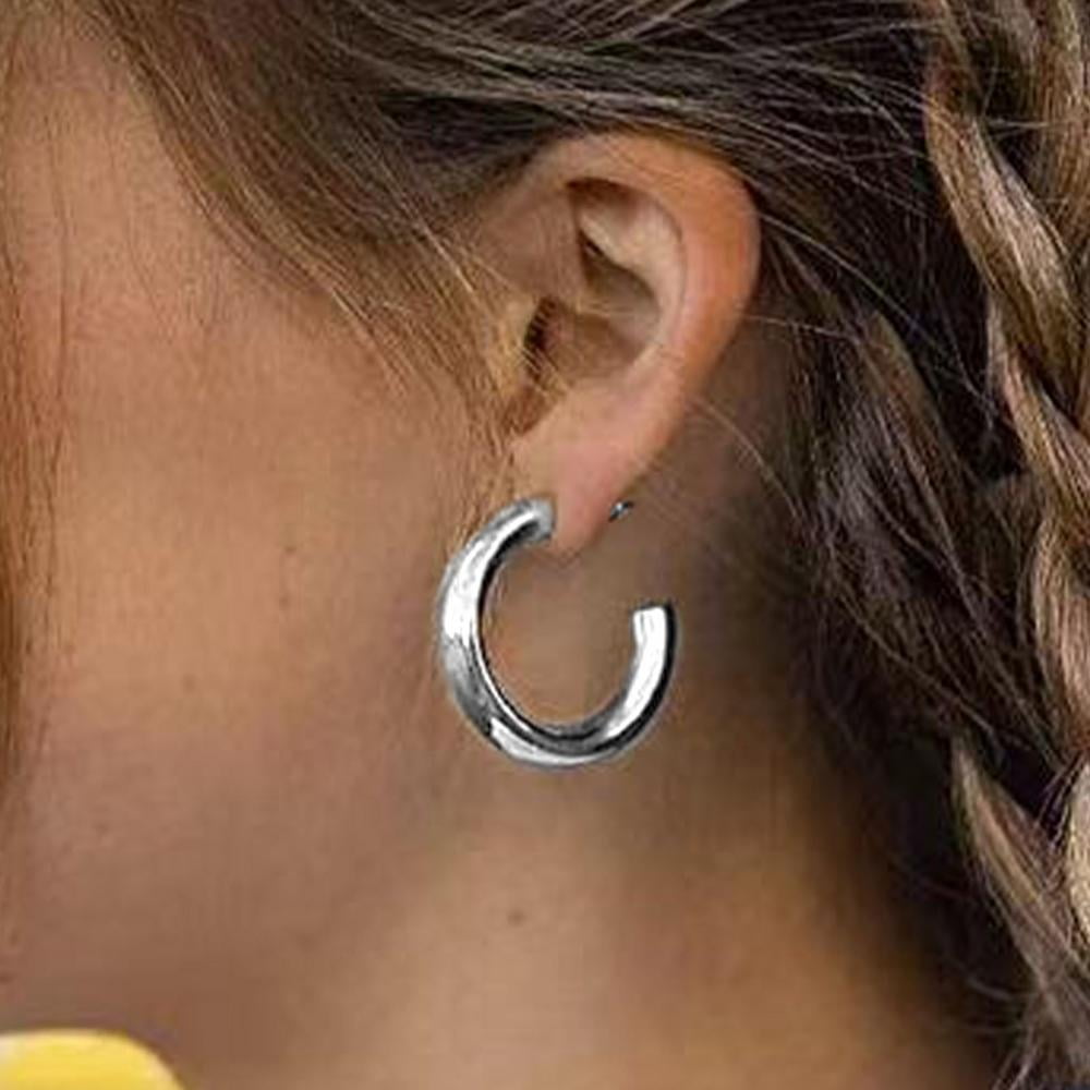 Why do men never wear big hoop earrings, like women, even if they don't  have dangerous jobs so their hoops can get caught? - Quora