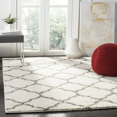 Safavieh New York Shag SG168 Indoor Area Rug The quatrefoil design and plush  shag texture of the Safavieh New York Shag SG168 Indoor Area Rug can accent your transitional or global living or dining room. This cozy rug feels great under your feet and has a solid-colored background with a contrasting  light quatrefoil pattern from edge to edge. Choose from available colors.