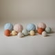 thumbnail image 4 of Juguete sensorial con esferas anidadas de silicona Mushie (rubor), 4 of 5