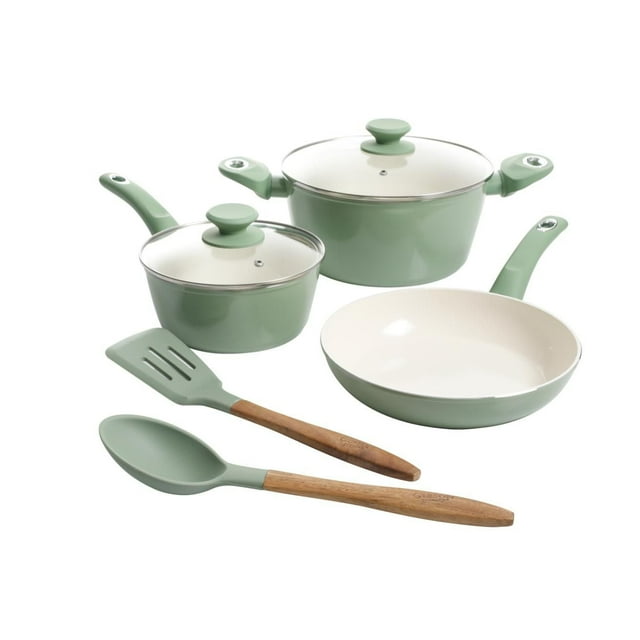 Gibson Plaza Café 7 piece mint green aluminum cookware set featuring two lidded pots, a frying pan with cream interior, and matching spatula and spoon with wooden handles.