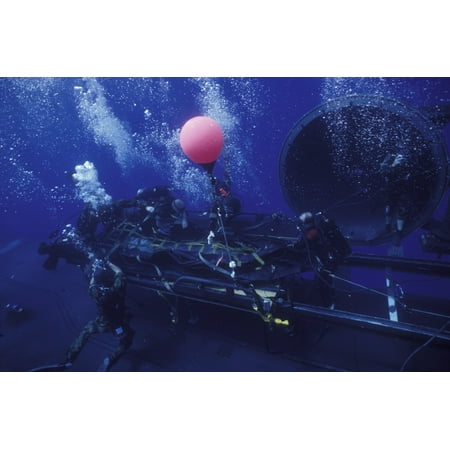 - Crewmen disconnect the cargo straps from the combat rubber raiding craft on the dry deck shelter Canvas Art - Michael WoodStocktrek Images (35 x 23)
