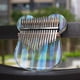 thumbnail image 4 of Piano de pulgar portátil de 17 tonos de cristal transparente con forma de conejo y oso, fácil de transportar, 4 of 4