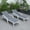 Gray, variant on LeisureMod Marlin Poolside Outdoor Patio Lawn and Garden Modern White Powder Coated Aluminum Frame Suntan Sling Chaise Lounge Chair with Armrests, Set of 2 (Green)