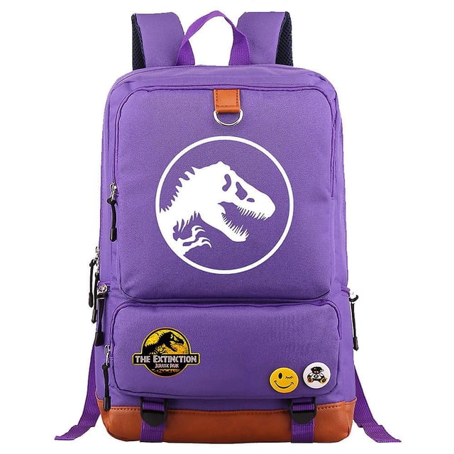 jurassic world jurassic park backpack - spacious shoulder laptop travel bag, rucksack, and messenger bag morado con logo blanco de dinosaurio centrado en vista frontal; mochila rectangular de tela Oxford con base tipo cuero marrón, tirantes acolchados y asa superior, doble bolsillo frontal con cremalleras, bolsillos laterales, compartimento para computadora portátil, bolsillo interno para móvil e identificación y peso aprox. 0.6 kg; también suele usarse como bolsa de viaje compacta para viajes cortos.