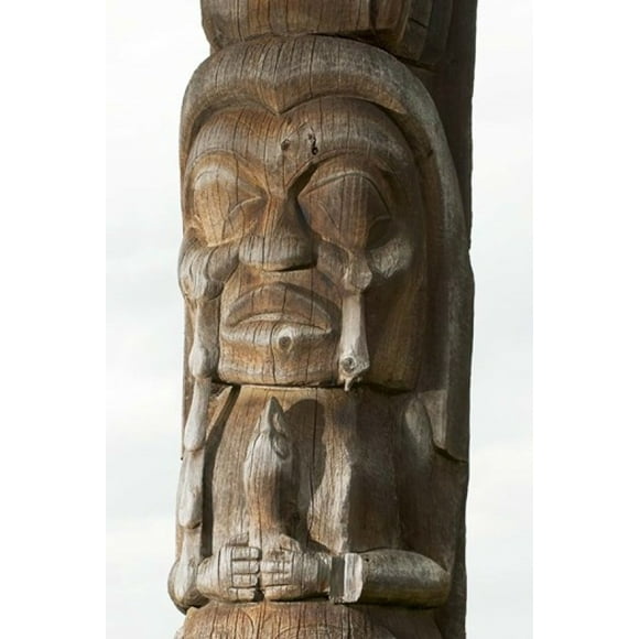 Gitksan totem pole, Kispiox Village, British Columbia Poster Print by Paul Colangelo (18 x 26)