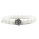 thumbnail image 1 of Pulsera con dije de huella de pata de piedra volcánica de lava negra mate natural, ideal como recuerdo para mascotas, amantes de los gatos y los perros., 1 of 2