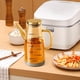 thumbnail image 5 of Pisexur Batería de cocina Botella dispensadora de aceite mejorada 2025 con pico antigoteo, botella dispensadora de aceite de oliva de vidrio de 34 oz para cocina, con para la cocina del hogar, 5 of 6