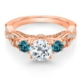 thumbnail image 2 of Gem Stone King 18K Rose Gold Plated Silver White Topaz London Blue Topaz and White Moissanite Engagement Ring for Women (1.43 Cttw, Gemstone November Birthstone, Round 6MM and 3MM, Size 8), 2 of 4
