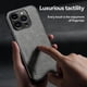 thumbnail image 3 of Funda de cuero magnética con tacto de piel para iPhone 15 Pro, 3 of 5