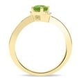 thumbnail image 2 of SZUL Women's Round Shaped Peridot and Diamond Wave Ring in 10K Yellow Gold, 2 of 5