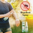 A person holding a spray bottle of mosquito repellent, with a nearby display of different repellent products and a graphic showing a mosquito with a red crossed-out symbol.