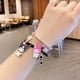 thumbnail image 3 of Sanrio-pulsera de Anime My Melody Kuromi para hombre y mujer, brazalete de dibujos animados, bola magnética, regalo para niña, banda de goma Kawaii, Juguetes, 3 of 4