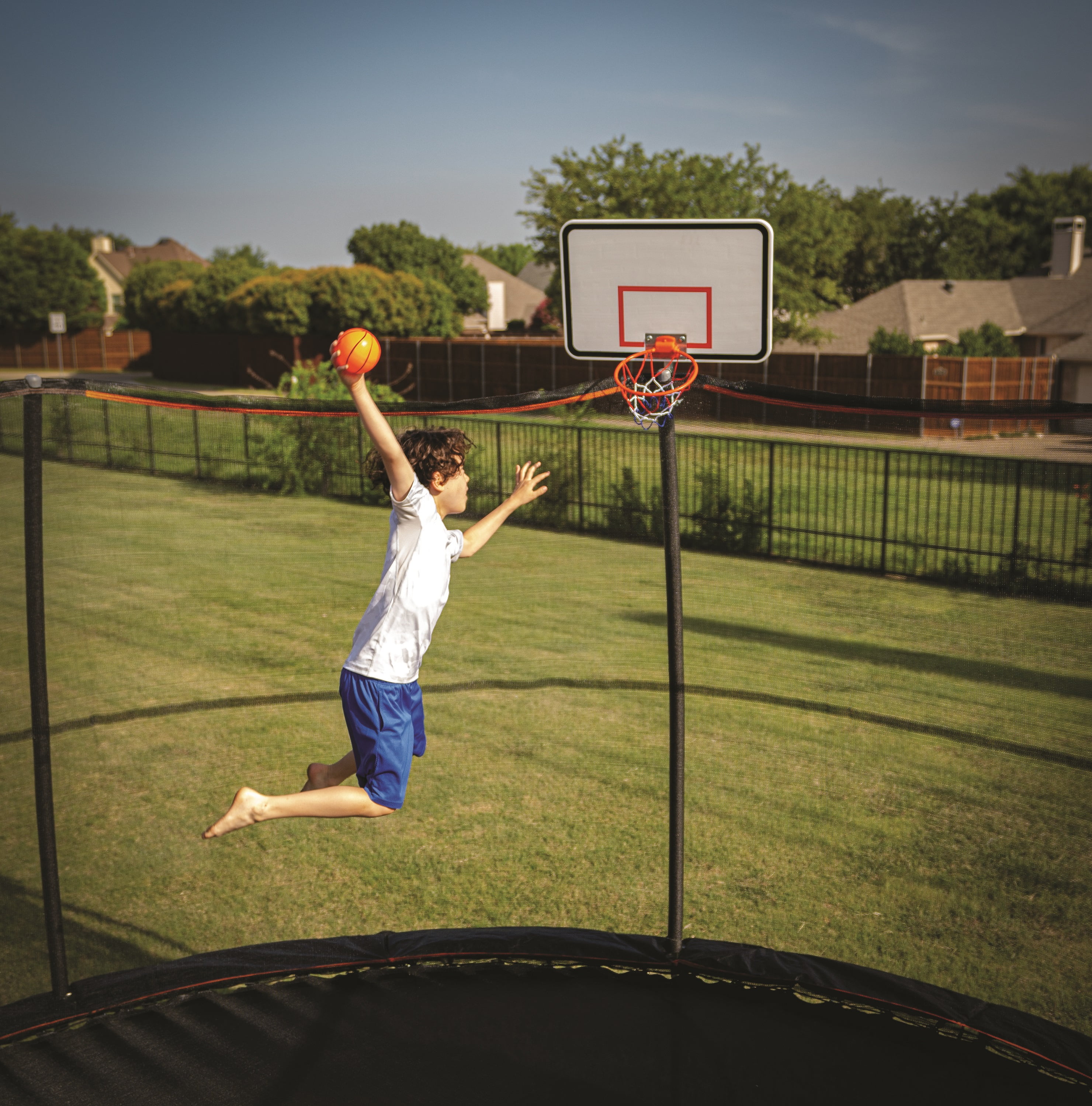 Trampoline with a basketball hoop top