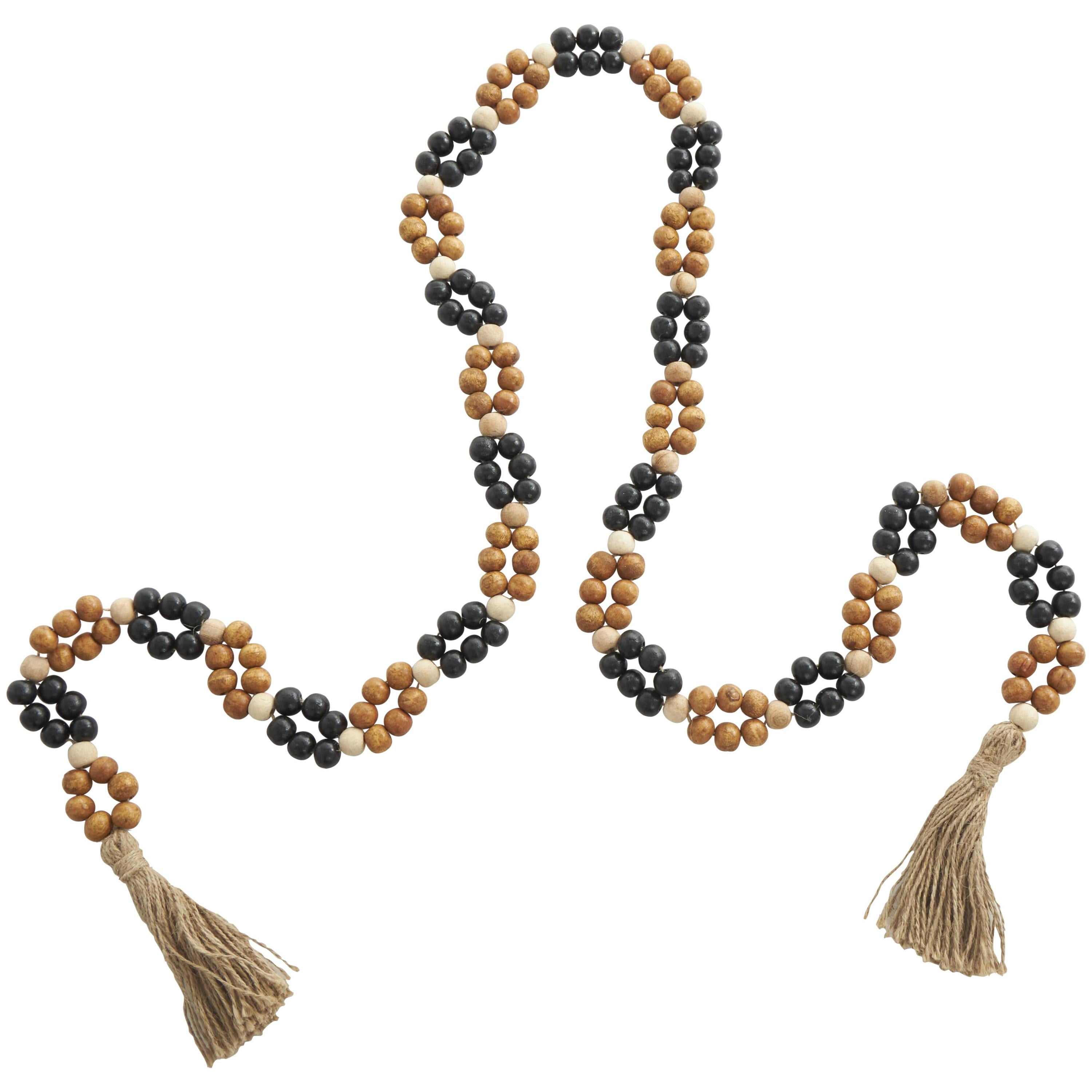 DecMode Handmade Round Double Layered Long Carved Brown Mango Wood Garland with Tassel with Black and Cream Accents