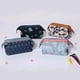 thumbnail image 5 of Vogacara El poliéster lleva cómodamente los cosméticos con un elegante organizador de viaje. La lona es resistente y duradera. Bolsas de maquillaje Flores Negras, 5 of 6